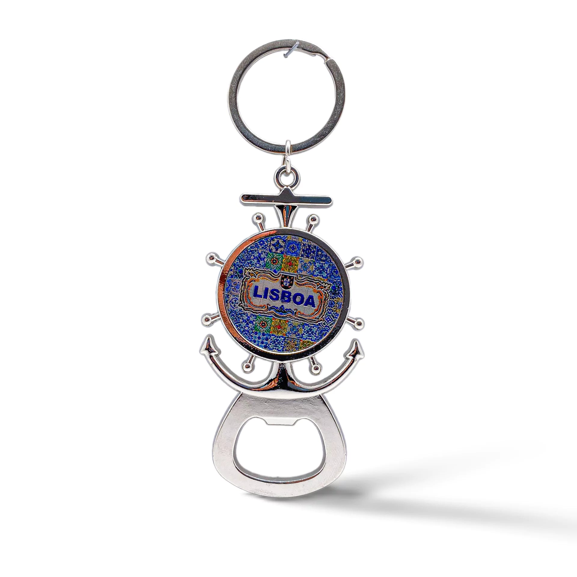 A silver keychain bottle opener, shaped like a ship's wheel and anchor, features a blue and yellow mosaic design with "Lisboa" in the center. This charming souvenir is perfect for any Lisbon enthusiast.