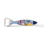 A sardine-shaped bottle opener with a colorful illustration of Lisbon, Portugal on the handle. The illustration includes iconic city landmarks, traditional Portuguese tiles, and a tram. The handle is elongated and the opener part is at the fish's mouth. Plus, it doubles as a magnet for your fridge.