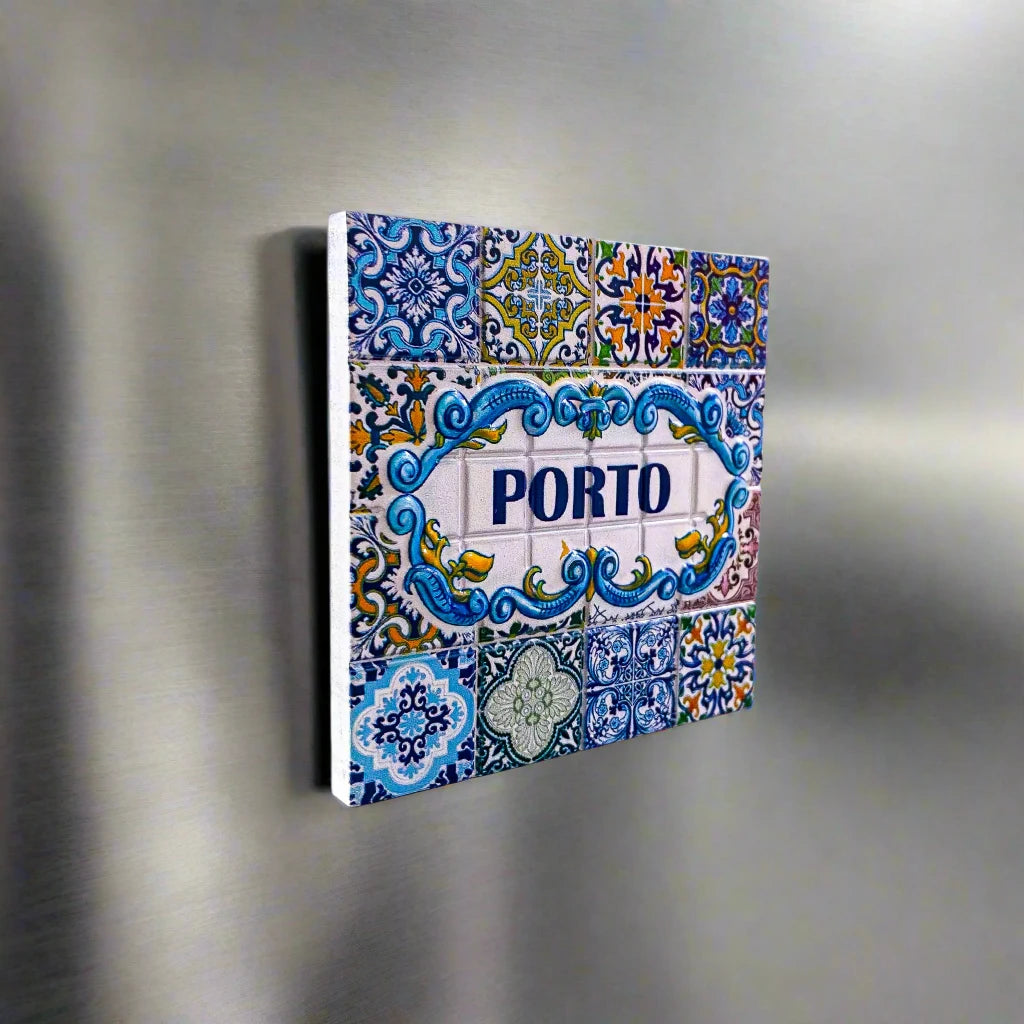 This vibrant ceramic tile magnet showcases detailed designs in blue, yellow, green, and white. At the center, the word "PORTO" appears in bold blue, surrounded by decorative patterns inspired by classic Portuguese azulejos. An ideal keepsake from Portugal.