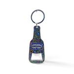 A keychain designed like a bottle opener with intricate, colorful patterns and the word "PORTUGAL" printed on it, complete with a magnet on the back. The keyring is attached at the top of the bottle-shaped opener.