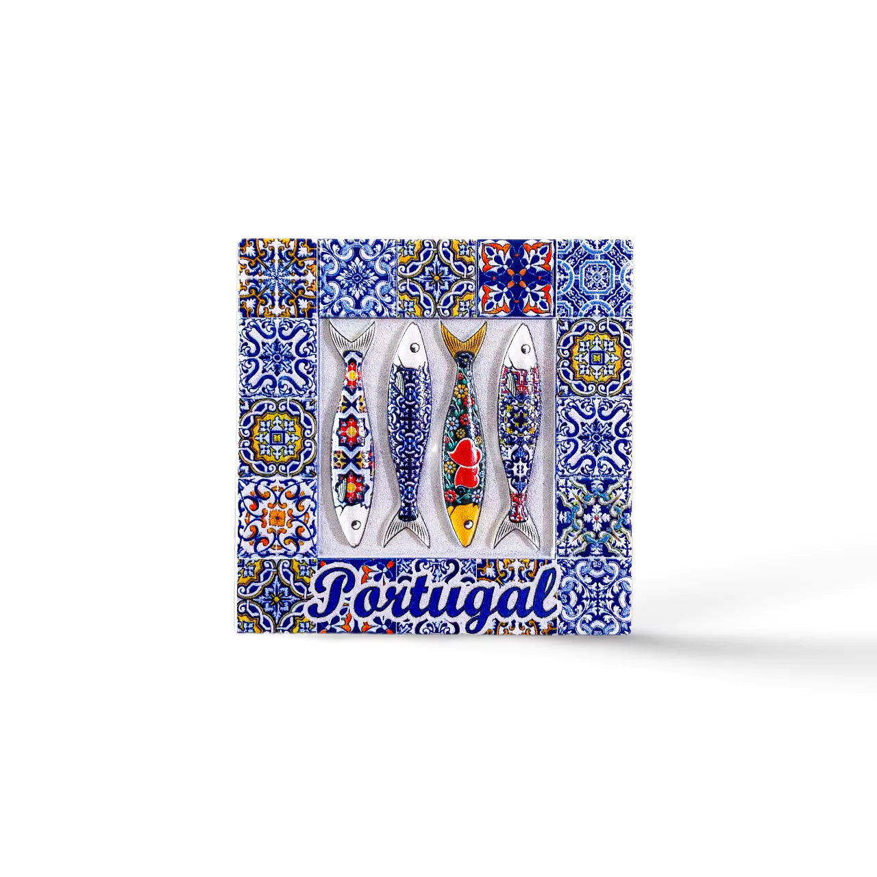 A decorative tile magnet features four fish adorned with colorful patterns, set against a backdrop of intricate blue and white azulejo designs. The word "Portugal" is written in blue cursive at the bottom, making it a charming souvenir.