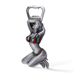 A metallic bottle opener designed in the shape of a Portuguese girl kneeling with her hands behind her head. She sports a bikini adorned with the colors and emblem of Portugal, and "Portugal" is written at the top. Additionally, it features a magnet on the back for easy storage on any metal surface.