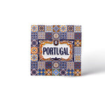 A decorative ceramic tile magnet featuring intricate, colorful patterns with the word "Portugal" centered in bold blue letters and framed with ornate yellow and blue designs. This exquisite piece showcases traditional Portuguese azulejos art style, making it a perfect souvenir from Portugal.