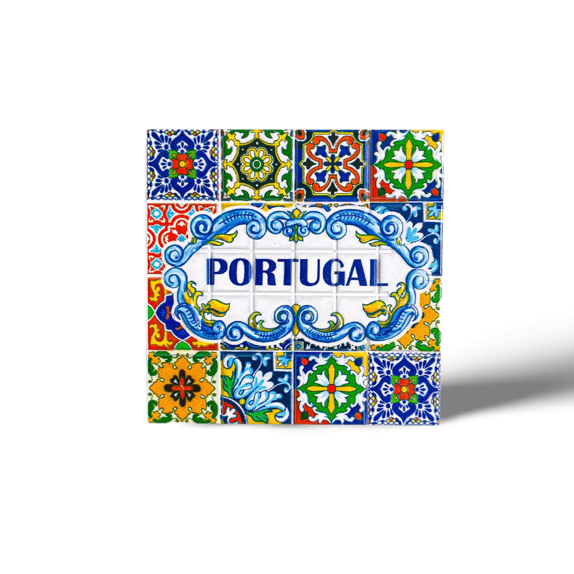 Tile artwork with intricate, colorful patterns featuring traditional Portuguese azulejo designs. The central tile includes the word "PORTUGAL" in blue letters set within an ornate, swirling blue and white frame, surrounded by vibrant floral and geometric motifs. A perfect souvenir magnet for collectors.