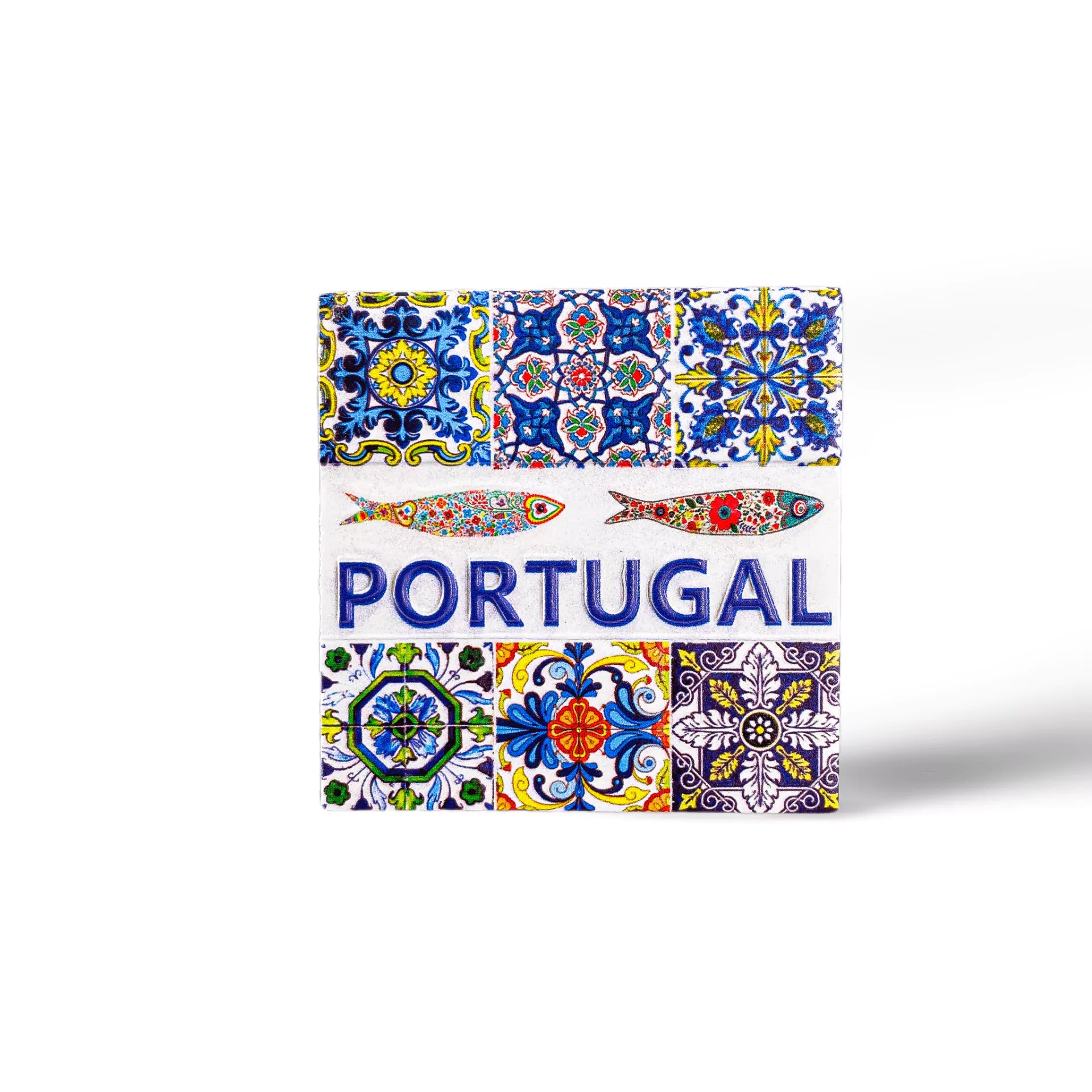 A decorative square magnet featuring traditional Portuguese tiles with intricate, colorful patterns surrounds the word "PORTUGAL" in blue text, accompanied by illustrations of two stylized fish above the text. This charming piece makes for a perfect souvenir.