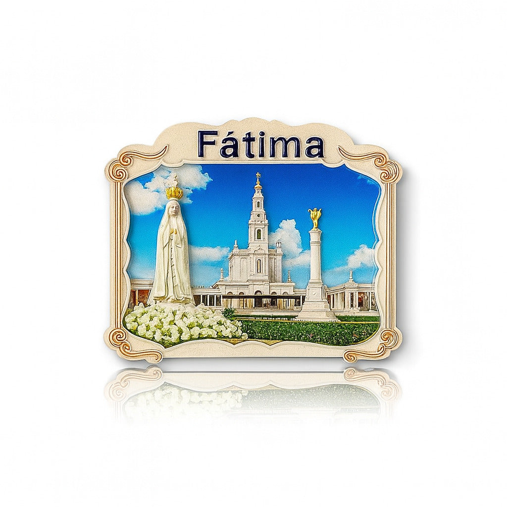 A colorful fridge magnet featuring an image of the Sanctuary of Fátima with the Basilica of Our Lady of the Rosary, a column with a statue on top, and white roses.