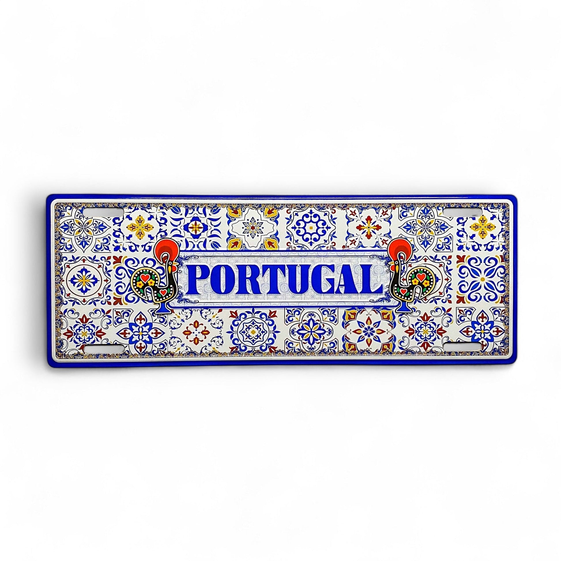 A decorative metal sign featuring the word 'PORTUGAL' in bold blue letters, surrounded by a traditional Portuguese azulejo tile pattern with Barcelos Rooster motifs.