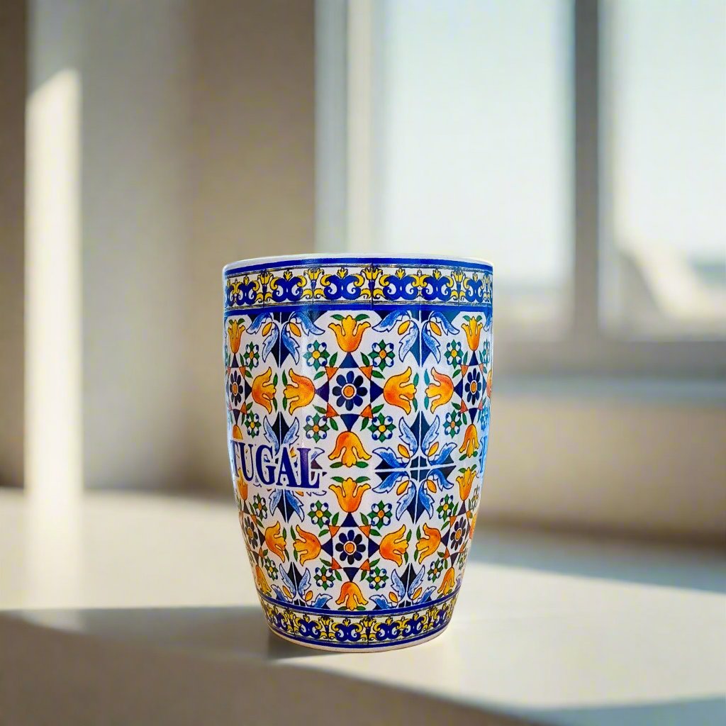 A beautifully crafted Portuguese mug with a spoon, featuring intricate tile designs, perfect for coffee or display.