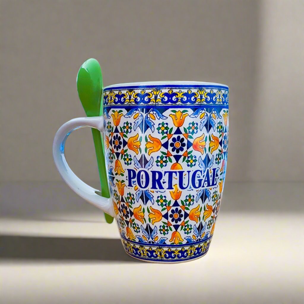 A charming Portuguese mug with a spoon, adorned with floral tile patterns, perfect for coffee or as a unique gift.