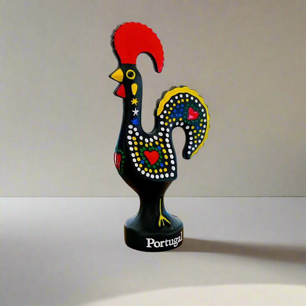A black rooster figurine with striking red and yellow feathers, a traditional souvenir known as the Galo de Barcelos from Portugal.