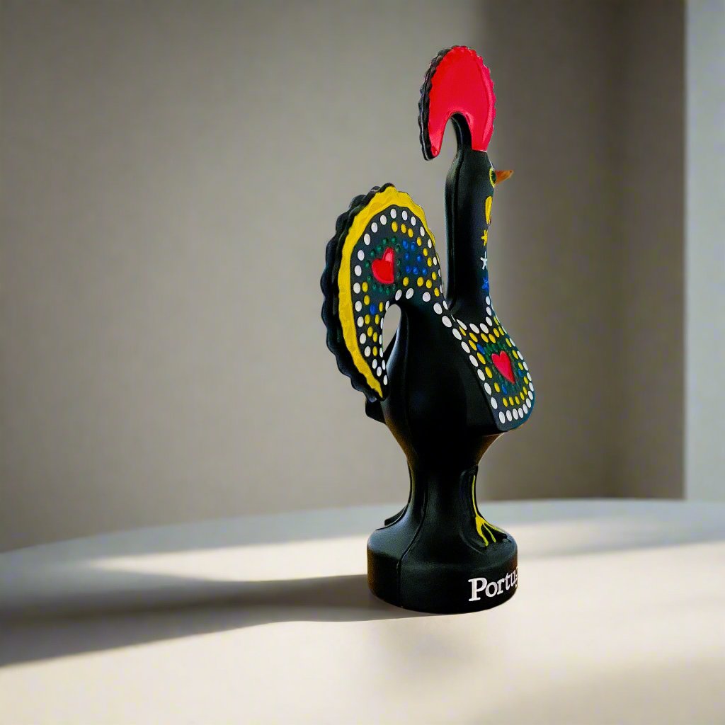 A decorative black rooster figurine featuring vibrant red and yellow feathers, symbolizing the Galo de Barcelos, Portugal.