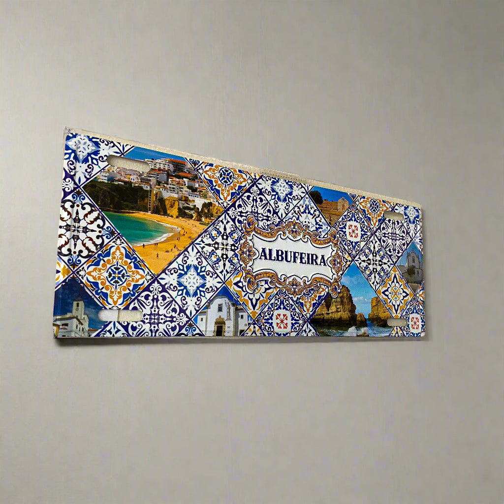 Decorative tile with 'Albufeira' design on a wall