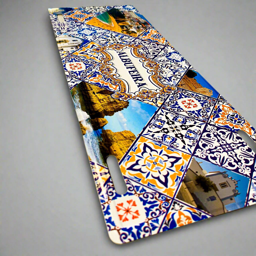 Decorative sign with colorful patterns and images of buildings and landscapes on a beige background.