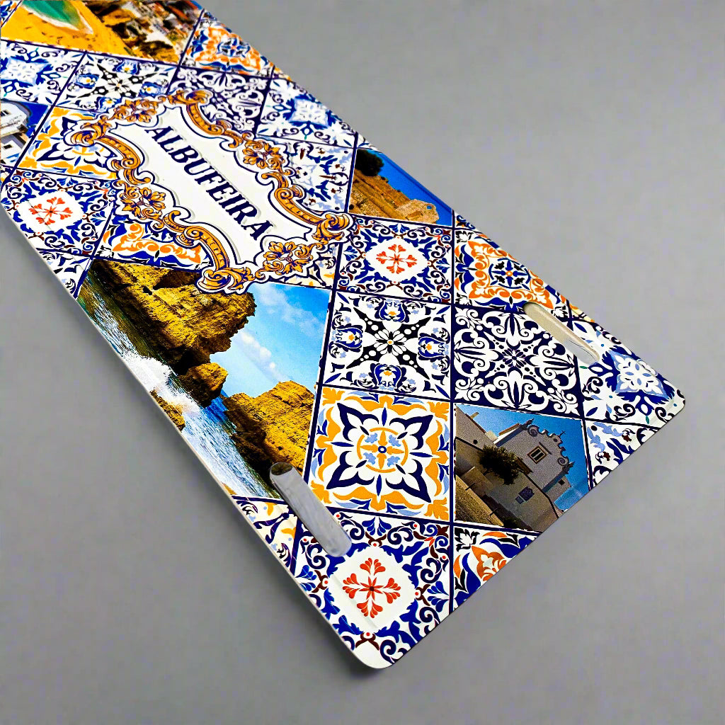 Decorative license plate with colorful tiles and scenic images on a beige background