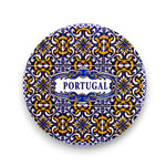 Decorative plate with Portuguese tile pattern and 'Portugal' text on a white background