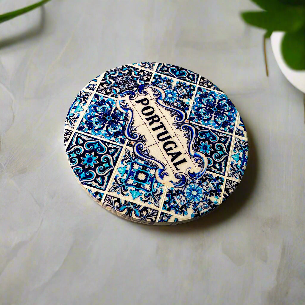 Decorative plate with blue floral patterns and 'Portugal' text on a beige background