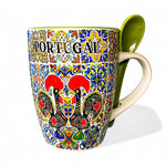 Colorful mug with 'Portugal' text and decorative patterns on a white background