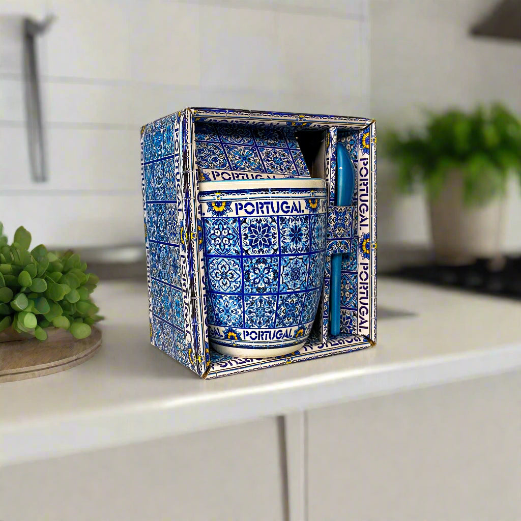 Decorative ceramic container with blue and white pattern and 'Portugal' text, placed inside a matching box.