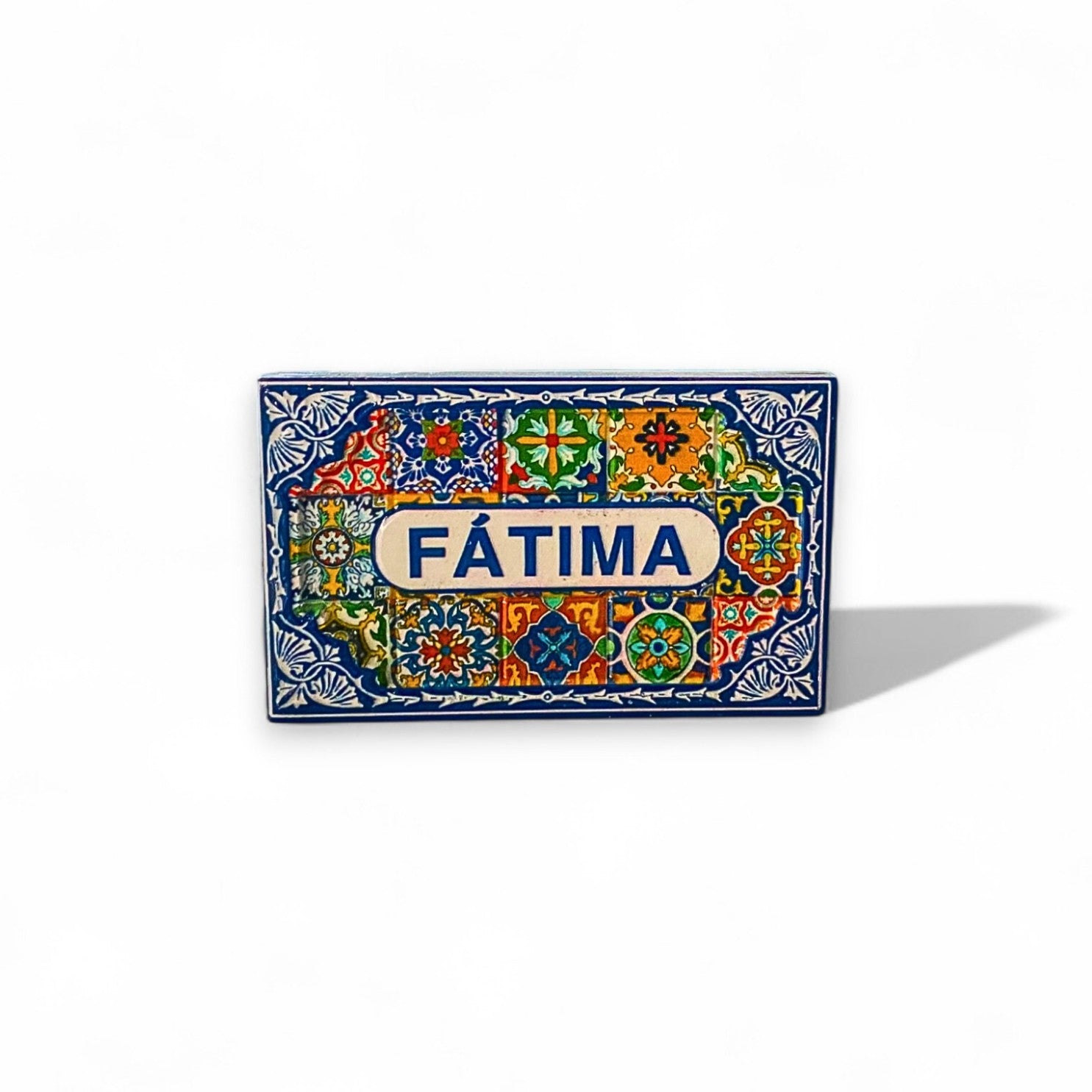 A rectangular fridge magnet featuring a colorful Portuguese tile pattern with the name 'Fátima' displayed prominently in the center.