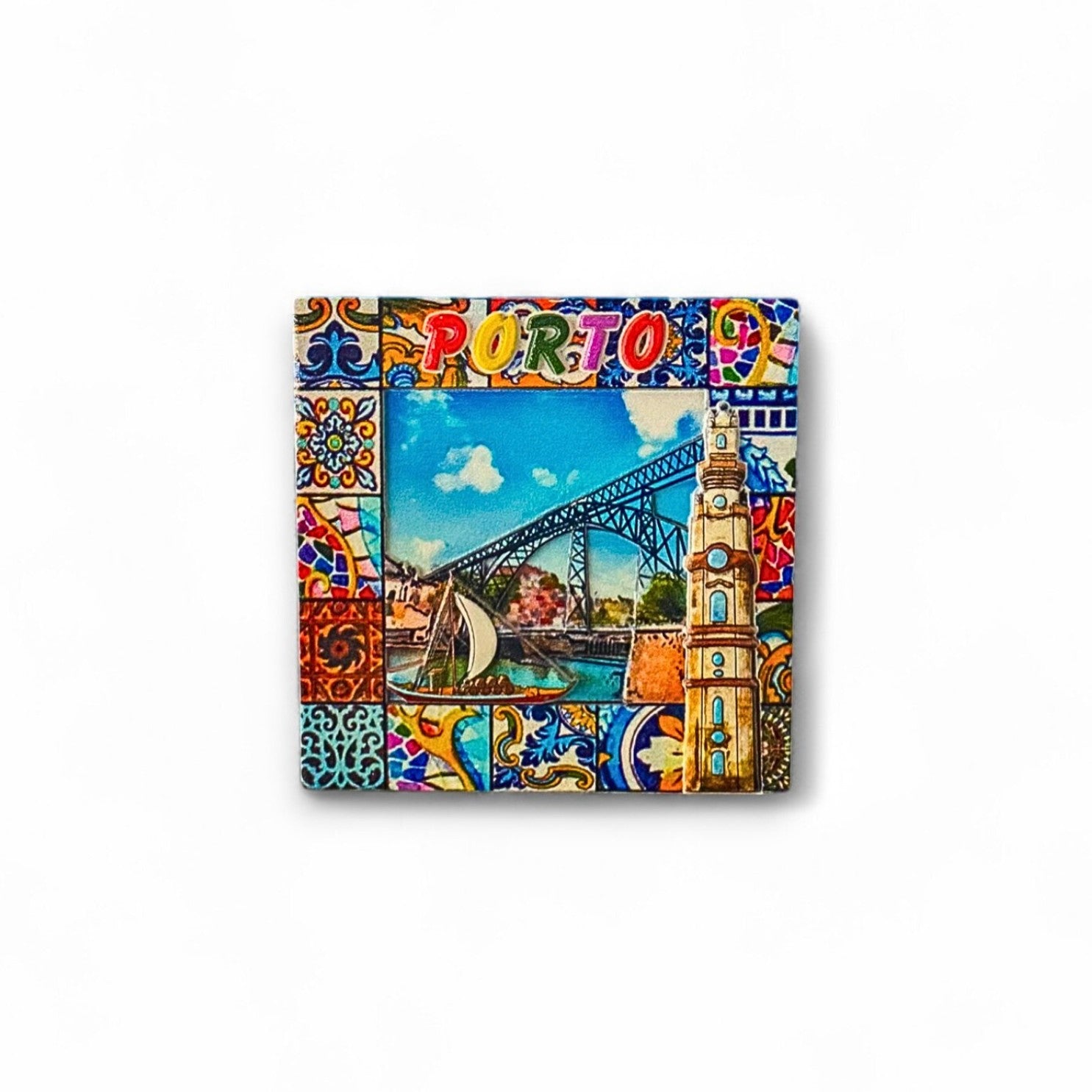 A colorful fridge magnet featuring illustrations of the Dom Luís I Bridge and Clérigos Tower with traditional Portuguese tile patterns around the border.