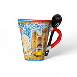 A ceramic mug with blue tile motifs and illustrations of Lisbon landmarks, accompanied by a black spoon, against a white background.