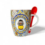 Mug with 'Portugal' and tram design, accompanied by a red spoon on a white background