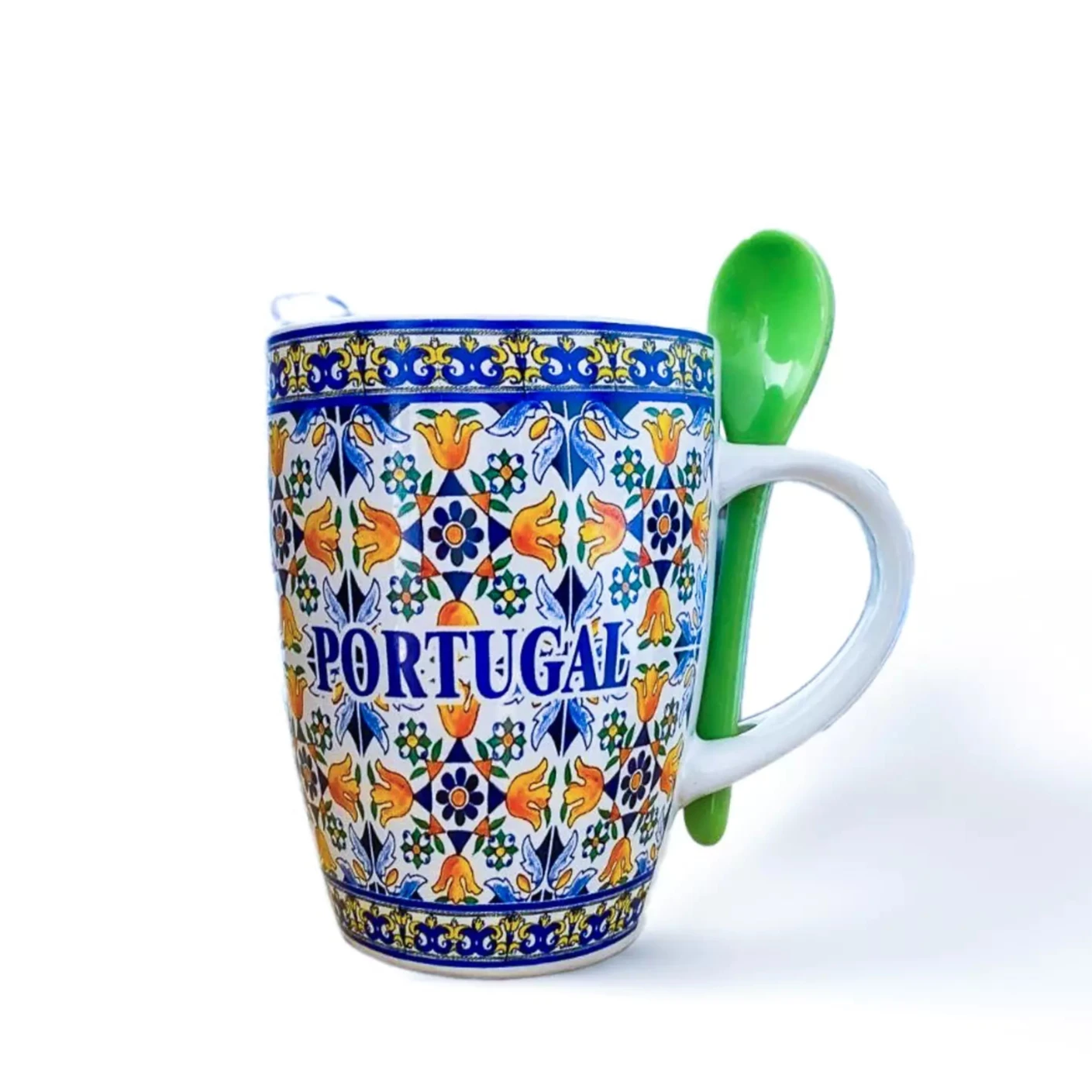 A floral tile mug with a spoon, showcasing Portuguese artistry, perfect for coffee or as a decorative piece.