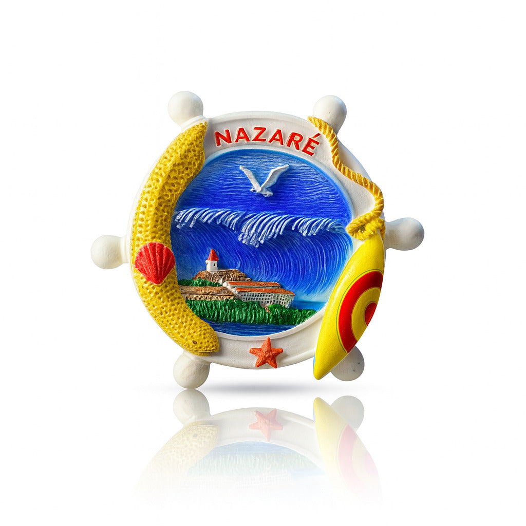 A colorful souvenir magnet featuring a ship's wheel design with a lighthouse and surfboard, capturing the essence of Nazaré, Portugal.
