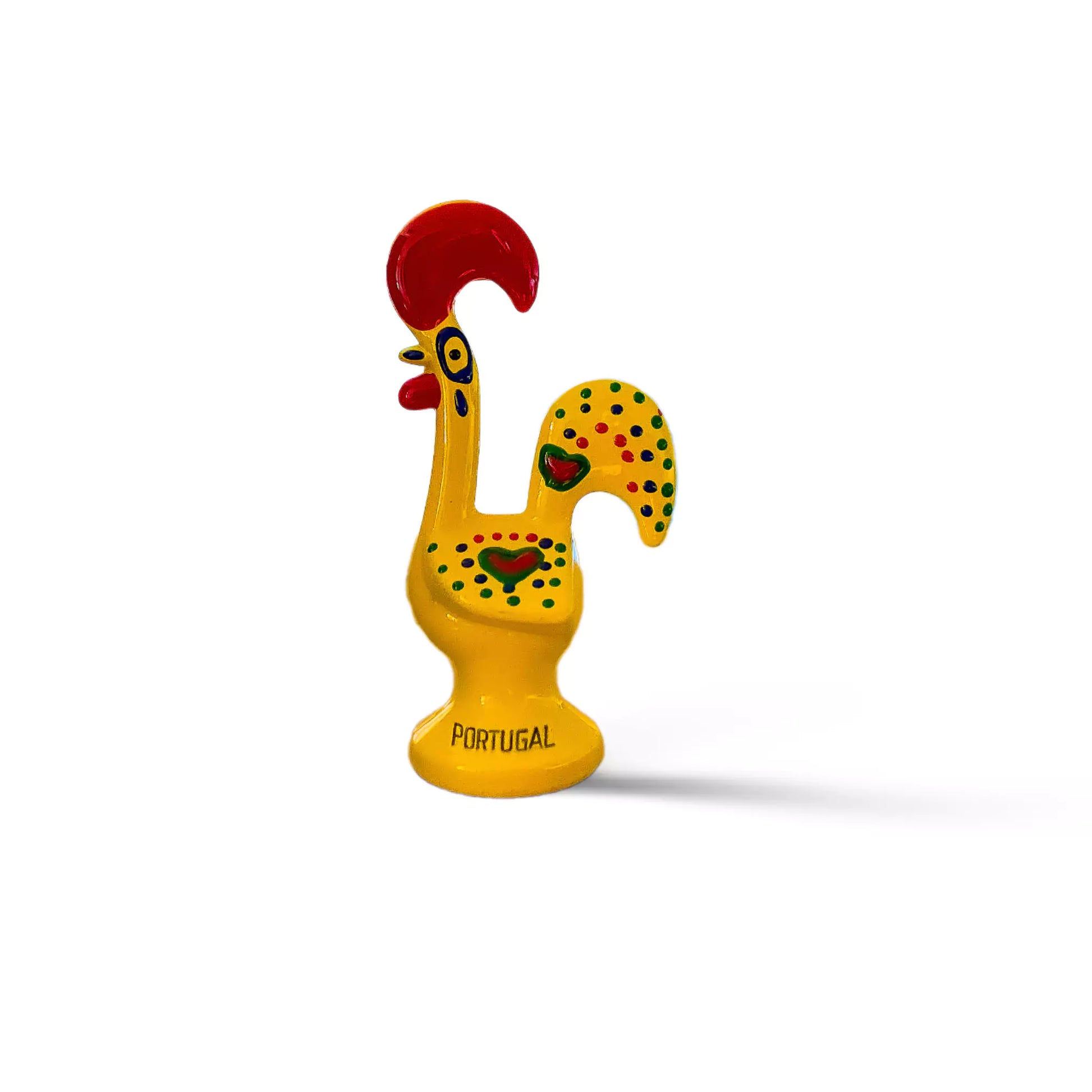 A vibrant yellow ceramic rooster, symbolizing the Galo de Barcelos, a cherished Portuguese souvenir.