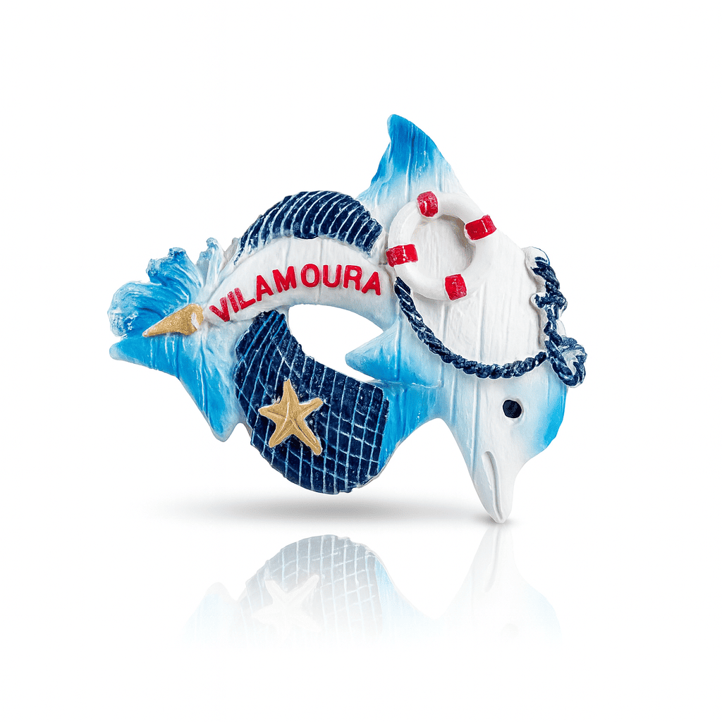 Magnet featuring a blue and white dolphin wrapped around a lifebuoy with red accents, the word “Vilamoura” in red, and a golden starfish on a textured navy background
