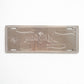 Back side of Albufeira metal souvenir sign showing raw metal surface with cut outlines and mounting slots