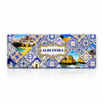 Albufeira metal souvenir sign isolated on white background featuring beaches, cliffs and traditional azulejos patterns