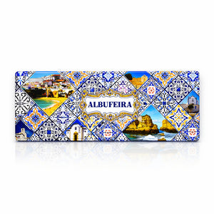 Albufeira metal souvenir sign isolated on white background featuring beaches, cliffs and traditional azulejos patterns