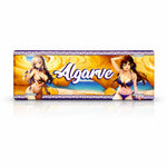 Algarve metal souvenir sign isolated on white background showing beach cliffs, ocean view and illustrated figures