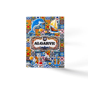 A colorful Algarve-themed magnet featuring a mosaic design with a dolphin, sailboat, lighthouse, and various sea elements. The word "Algarve" is prominently displayed in the center, surrounded by intricate patterns and vibrant colors, making it a perfect Portugal souvenir.
