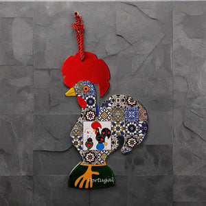 A vibrant wooden Barcelos rooster ornament adorned with a red comb and detailed mosaic patterns showcasing classic Portuguese motifs. It includes a red string for hanging, with "Portugal" written near the base, making it an ideal souvenir.
