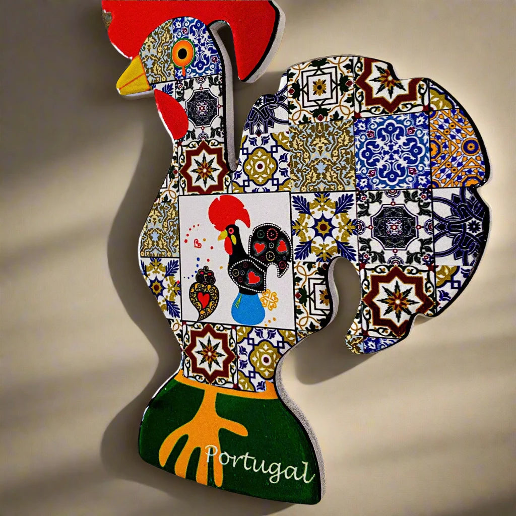 This colorful wooden Barcelos rooster features a red comb and intricate mosaic designs inspired by traditional Portuguese art. With a red hanging loop and "Portugal" inscribed near the base, it's the perfect keepsake.