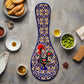 This decorative ceramic spoon-shaped memento showcases detailed patterns in shades of blue, yellow, and white. At the heart of the design is a colorful image of the iconic Portuguese rooster, framed by floral motifs. The word "PORTUGAL" is boldly displayed at the bottom.