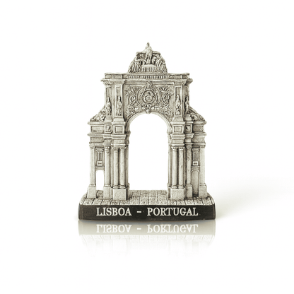 A small resin replica of the Rua Augusta Arch, a famous landmark in Lisbon, Portugal, featuring intricate neoclassical details and a plaque on the base with the monument's name.