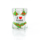 A clear molded glass shot glass with a bikini design and the text 'I ♥ ALGARVE' hand-painted on it, decorated with vibrant tropical details.