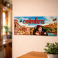 Coimbra metal souvenir sign mounted on a wall featuring university architecture, a fado musician and city landscape