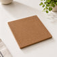 Back side of cork base featuring a smooth natural cork surface with minimalist square design and rounded corners.