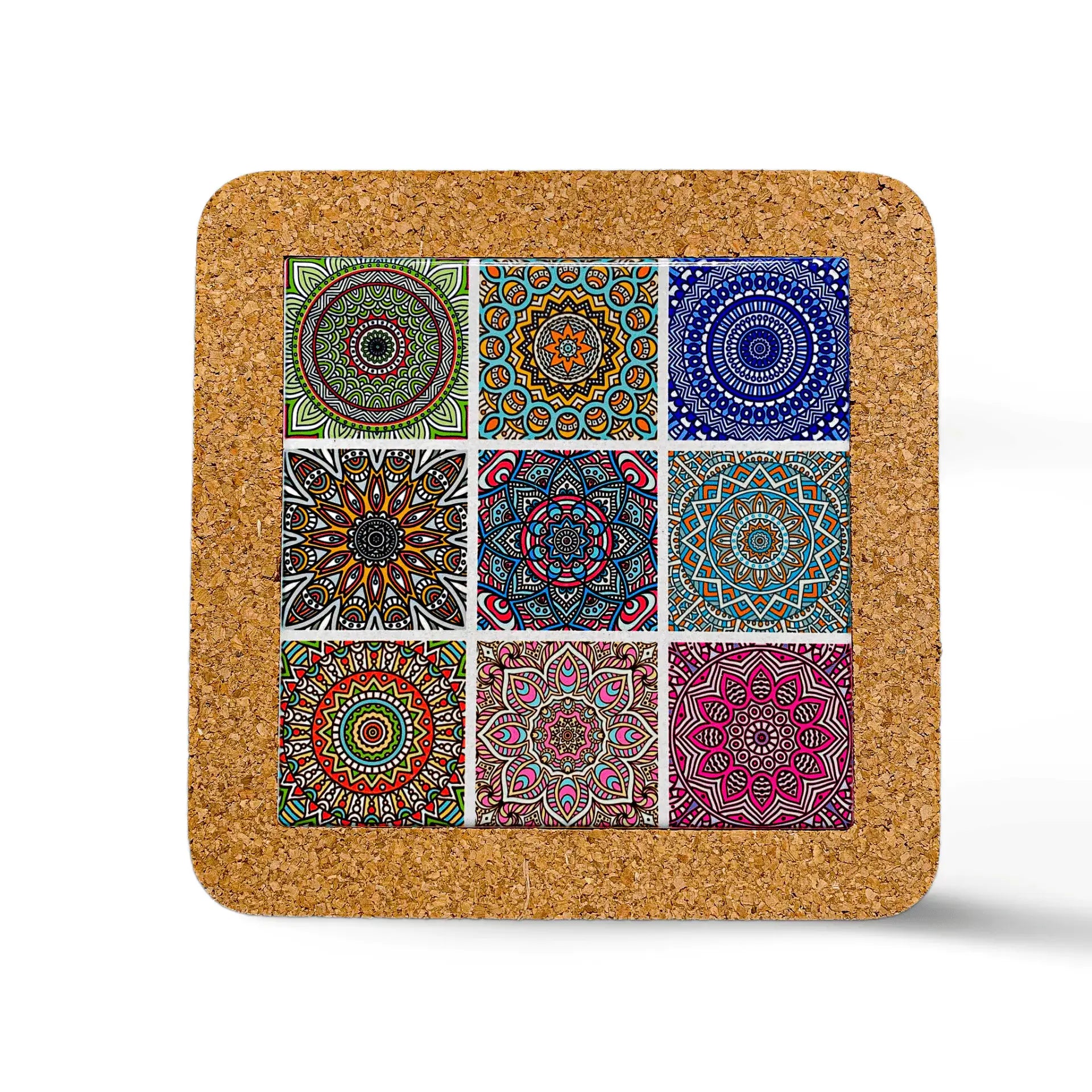 A square cork coaster, perfect as a souvenir, features a grid of nine colorful, intricate mandala patterns in designs and colors including green, blue, orange, and pink. Each section showcases a unique mandala on the white background.