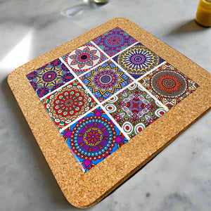 A square cork coaster displaying nine vibrant mandala designs in a 3x3 grid. The detailed mandalas, with their varied colors and patterns, create a lively and artistic effect against the natural cork surface, making it a perfect souvenir.