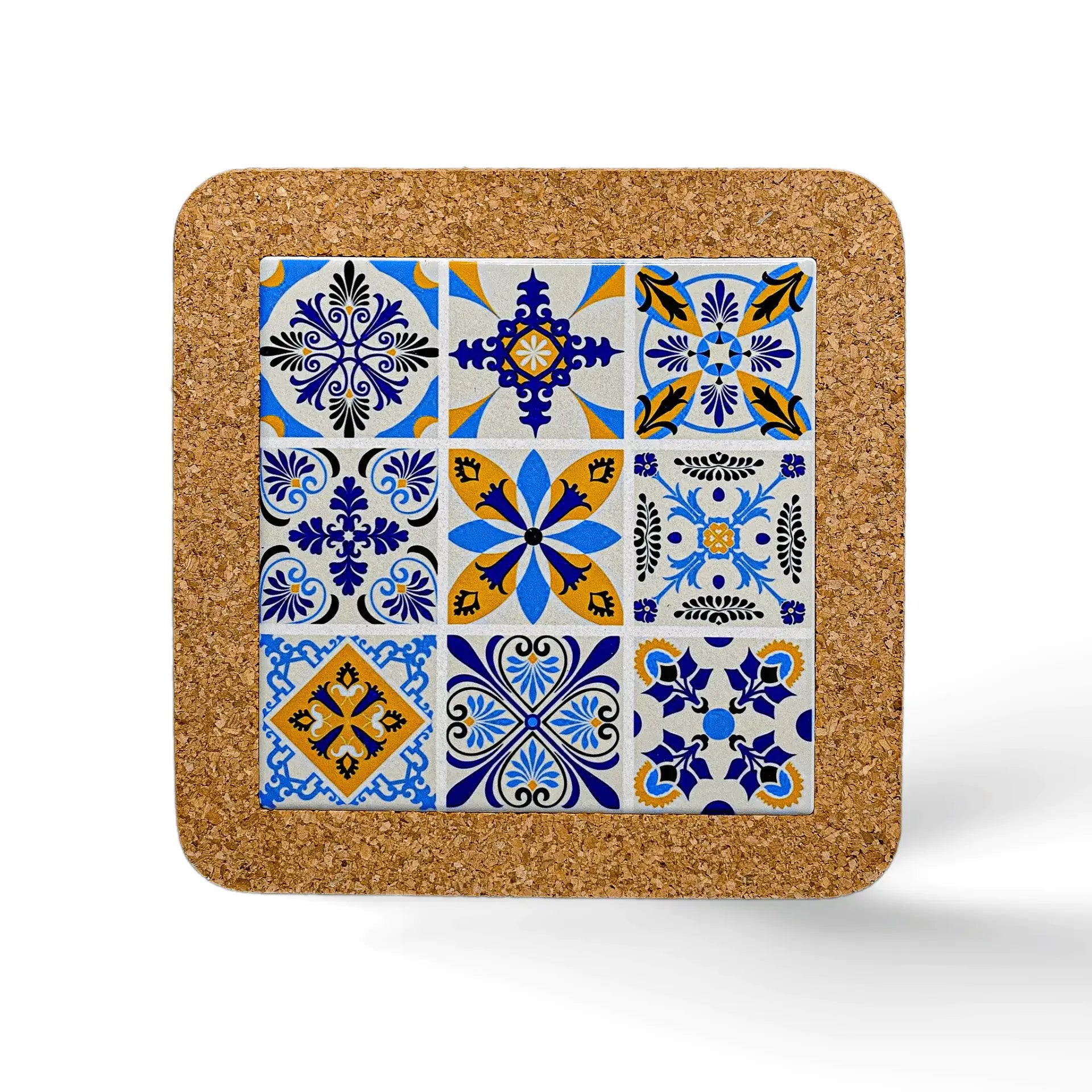 Square tile coaster with intricately patterned designs in blue, yellow, and white. The patterns vary, including floral and geometric motifs arranged in a 3x3 grid. This charming souvenir from Portugal boasts a durable cork base and rests on a white surface.