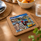 Angled view of Porto cork base featuring ceramic azulejo artwork with Porto landmarks, traditional tram, Barcelos rooster and Portuguese tile patterns.