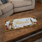 Fátima metal souvenir sign placed on a wooden table showing Our Lady of Fátima and the sanctuary with floral decorative details