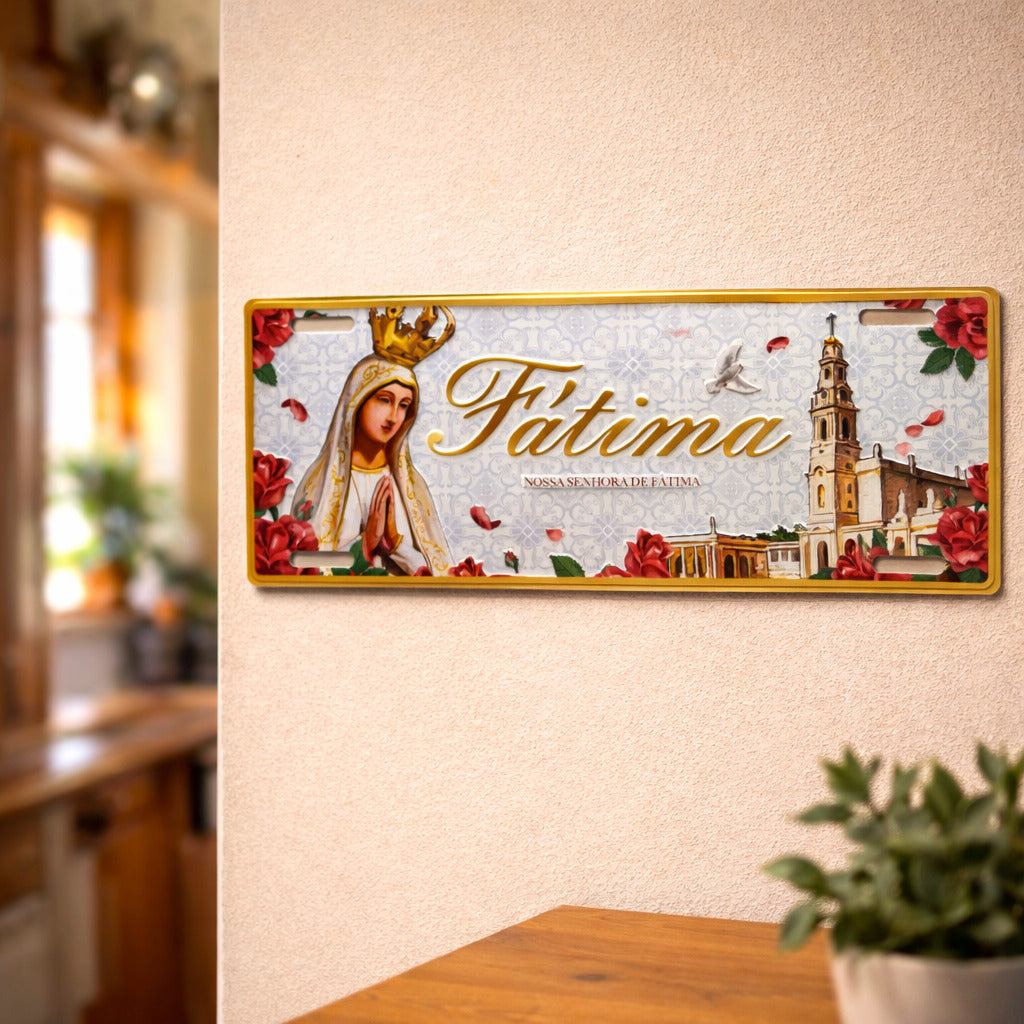 Fátima metal souvenir sign mounted on a wall featuring Our Lady of Fátima, the basilica, roses and decorative traditional elements