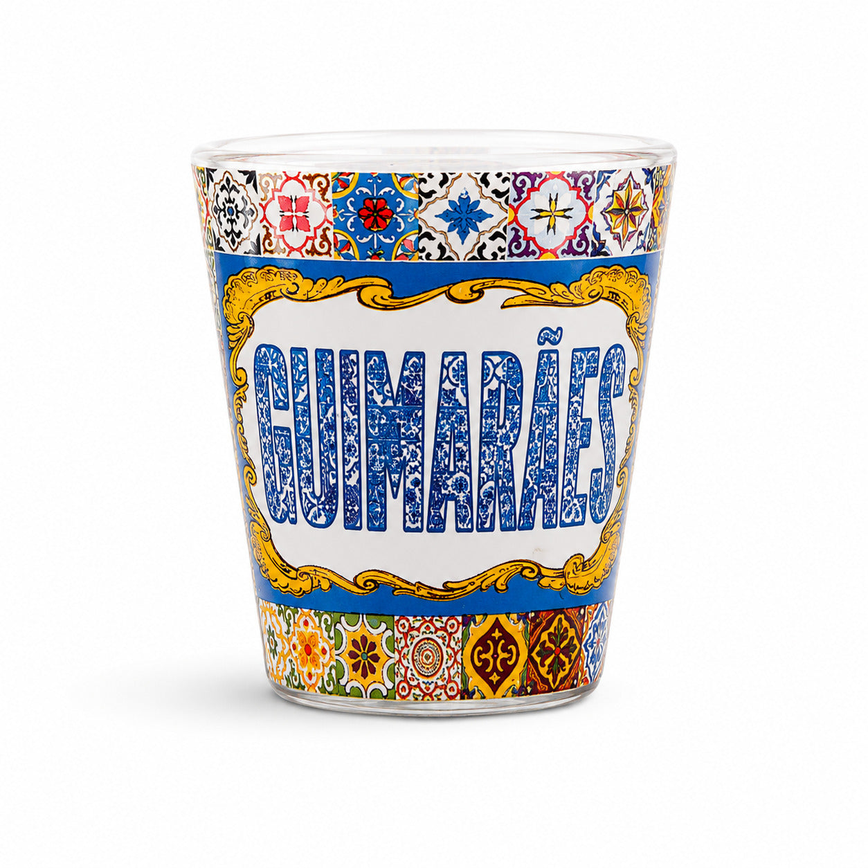 Studio image of Guimarães shot glass souvenir featuring vibrant Portuguese tile artwork and decorative vintage-style frame design