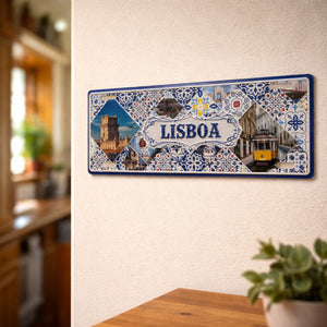 Lisboa metal souvenir sign mounted on a wall featuring Belém Tower, traditional tram and Portuguese azulejos patterns